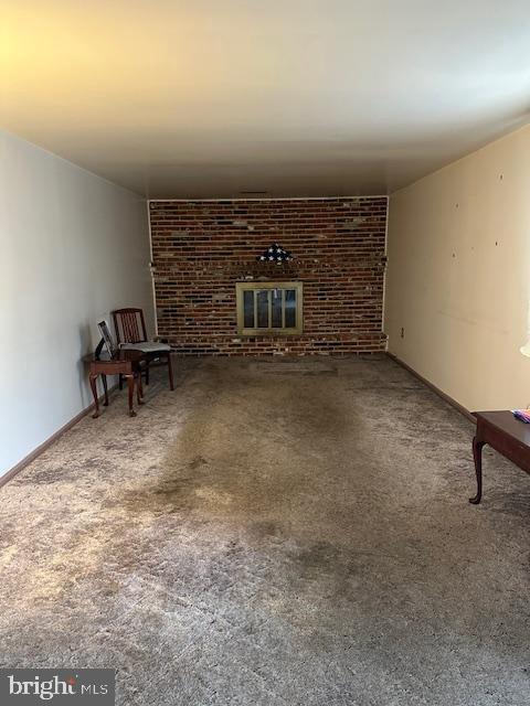 unfurnished living room with a fireplace