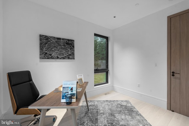 office area with light wood-type flooring