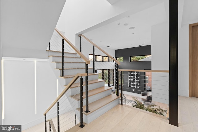 stairway featuring hardwood / wood-style flooring