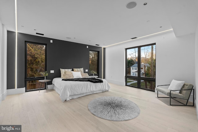 bedroom with light hardwood / wood-style floors