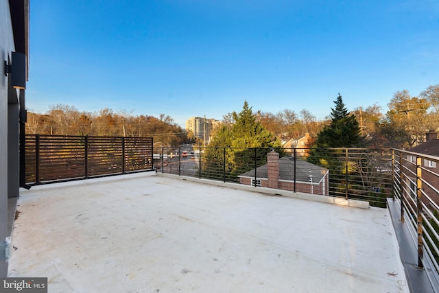 view of patio featuring a balcony