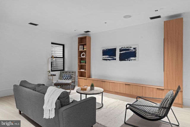 living room with light hardwood / wood-style flooring