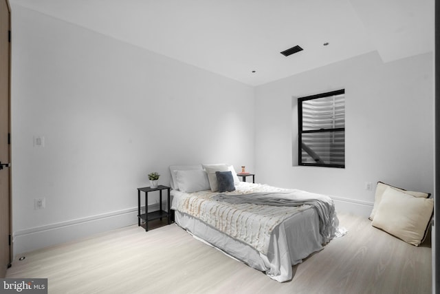 bedroom with light wood-type flooring