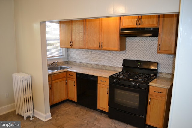 kitchen featuring tasteful backsplash, radiator, sink, and black appliances