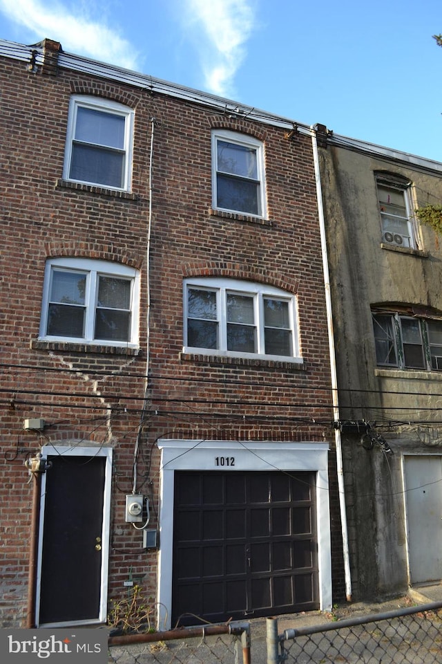 townhome / multi-family property featuring a garage