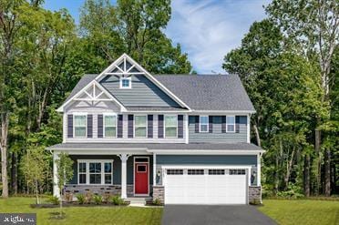 craftsman-style home with a garage and a front yard