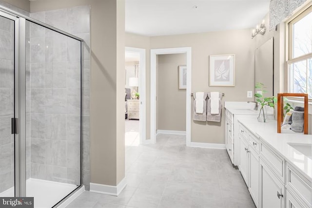 bathroom featuring vanity and an enclosed shower