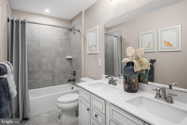 full bathroom featuring shower / tub combo with curtain, vanity, and toilet