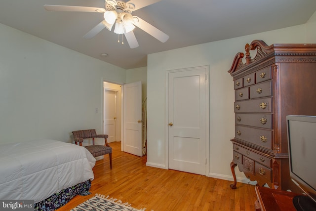 bedroom with ceiling fan and light wood-type flooring