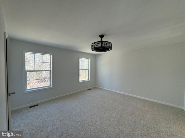 view of carpeted spare room