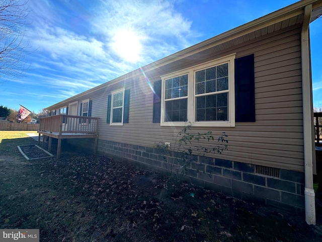 view of home's exterior featuring a deck