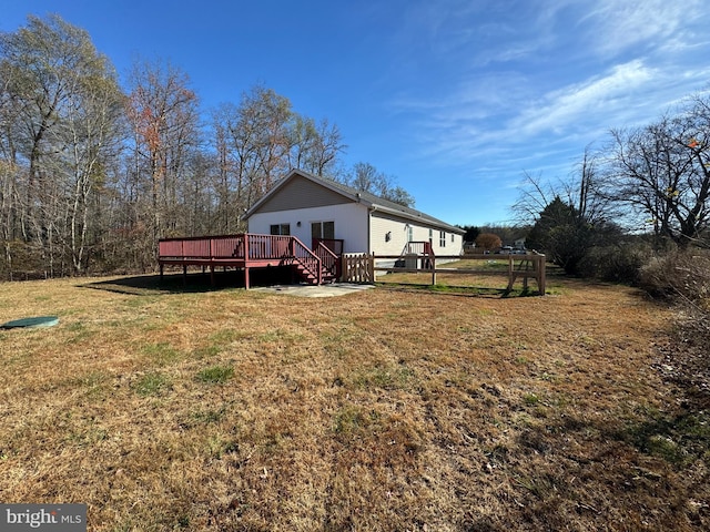 view of yard with a wooden deck