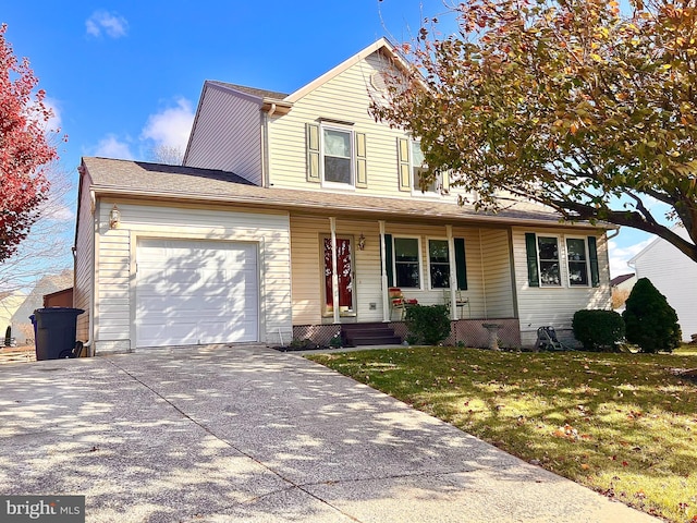 view of property with a garage and a front lawn