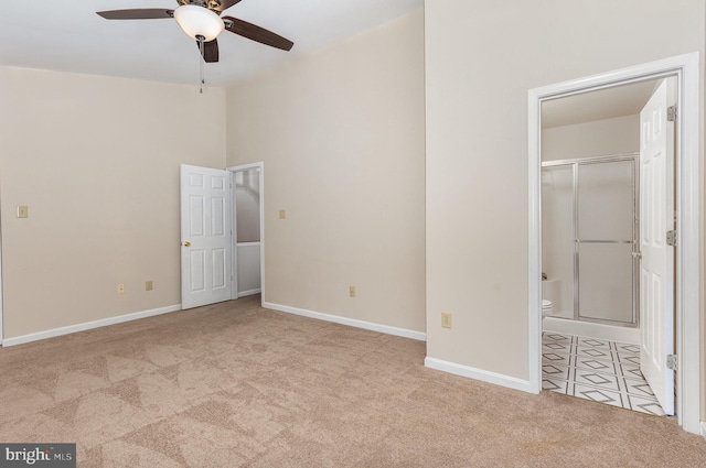 unfurnished bedroom featuring carpet floors and baseboards