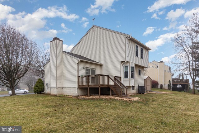 back of property with central air condition unit, stairs, a lawn, and a wooden deck