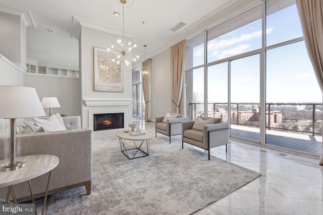 living room with a wall of windows, ornamental molding, and a chandelier