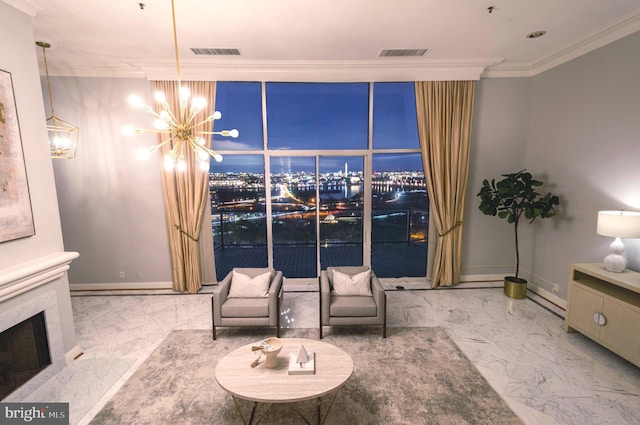 sitting room with a premium fireplace, an inviting chandelier, and ornamental molding