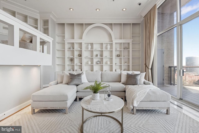 living room with hardwood / wood-style floors and ornamental molding