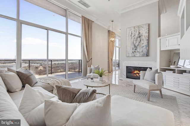 living room with crown molding and plenty of natural light