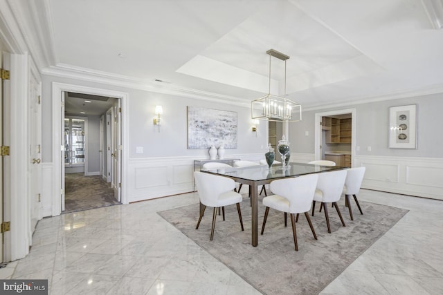 1401 N Oak St Unit 903, 905, Arlington, VA 22209 - dining space with ornamental molding, a decorative wall, a raised ceiling, a chandelier, and light marble finish flooring