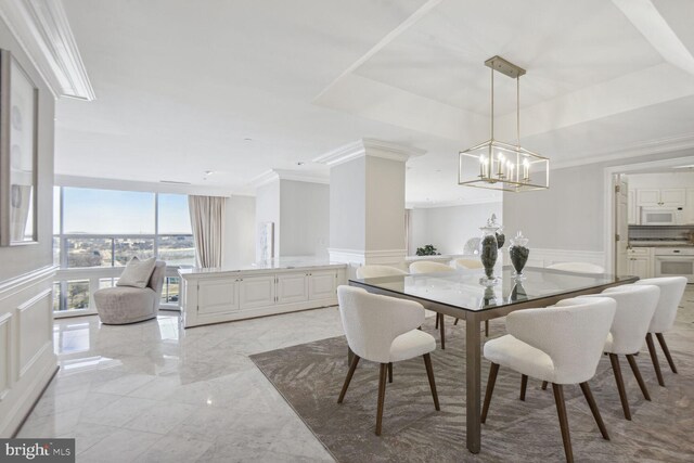 dining area featuring crown molding