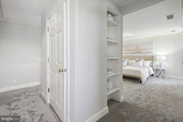 carpeted bedroom featuring ornamental molding