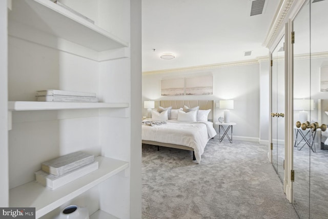 bedroom featuring light colored carpet and ornamental molding