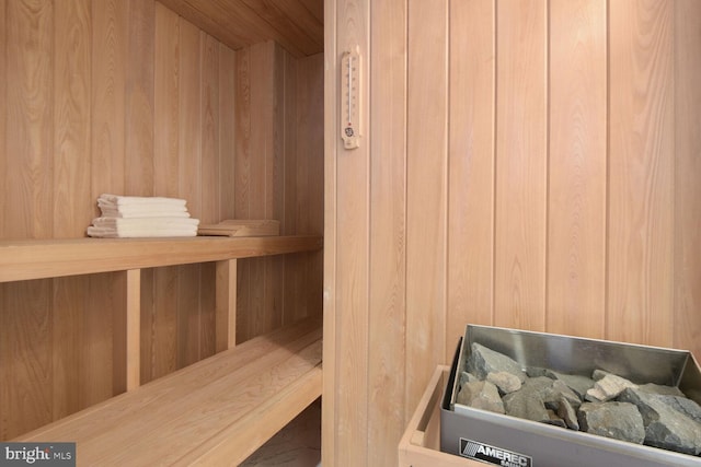 view of sauna with wooden walls