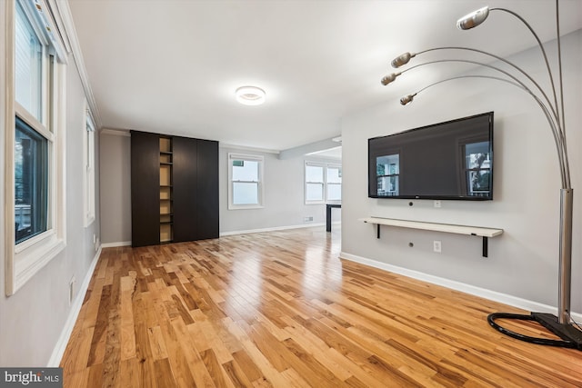 unfurnished living room with light hardwood / wood-style flooring