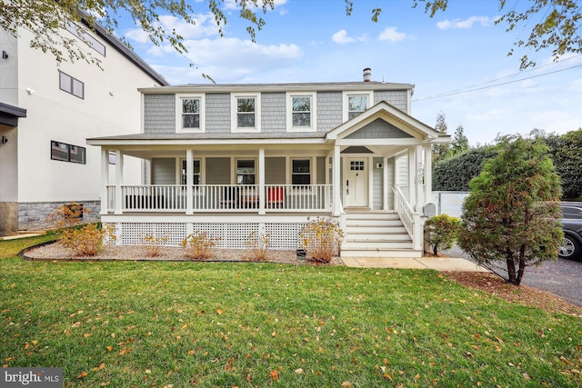 view of front of home featuring a porch and a front lawn