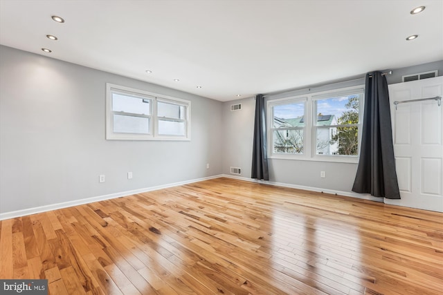 unfurnished room featuring light wood-type flooring