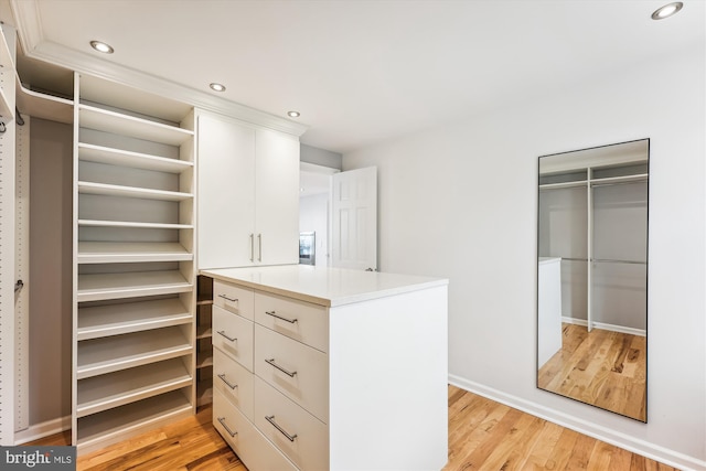 spacious closet featuring light hardwood / wood-style floors