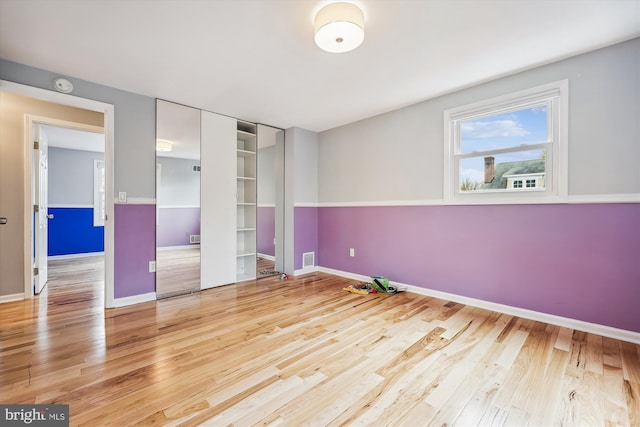 unfurnished bedroom with light hardwood / wood-style flooring