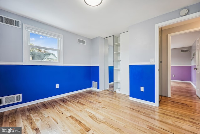 unfurnished room featuring light hardwood / wood-style floors