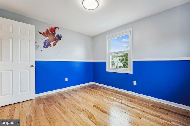 unfurnished room featuring hardwood / wood-style floors