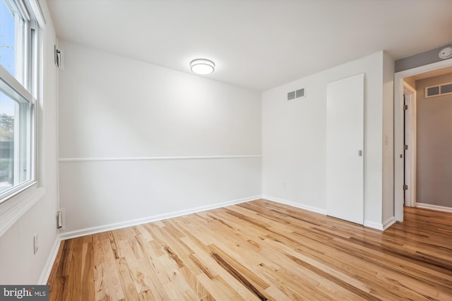 empty room featuring hardwood / wood-style floors