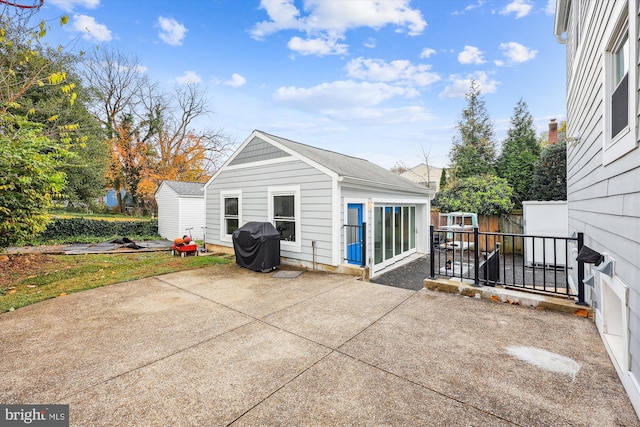 rear view of house featuring a patio