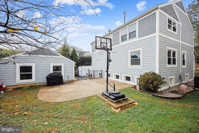 back of property featuring a patio area, a yard, and central AC unit