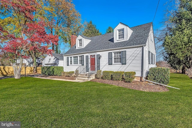 new england style home with a front yard