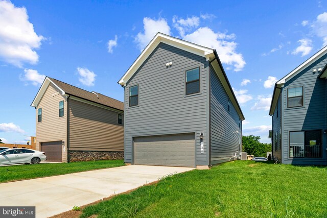 exterior space featuring a front yard and a garage