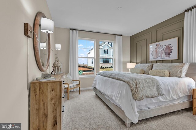 bedroom featuring light carpet