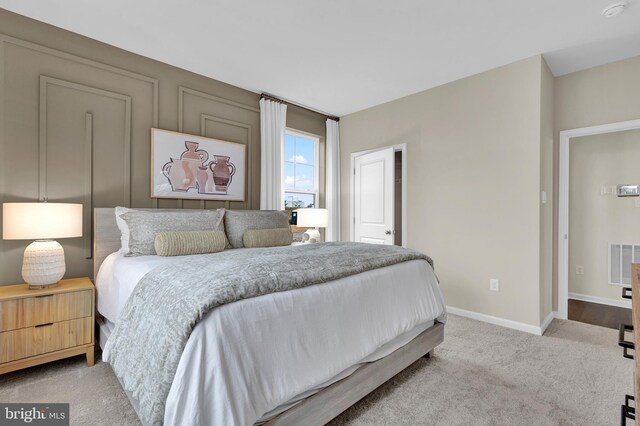 bedroom with light colored carpet