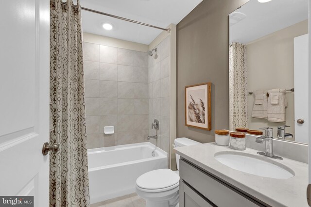 full bathroom featuring tile patterned floors, vanity, toilet, and shower / bathtub combination with curtain