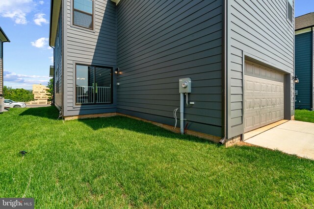 view of home's exterior with a lawn