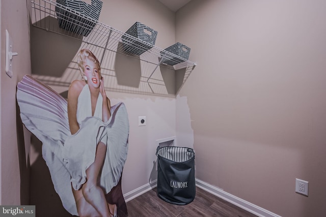 interior space with dark hardwood / wood-style floors and hookup for an electric dryer