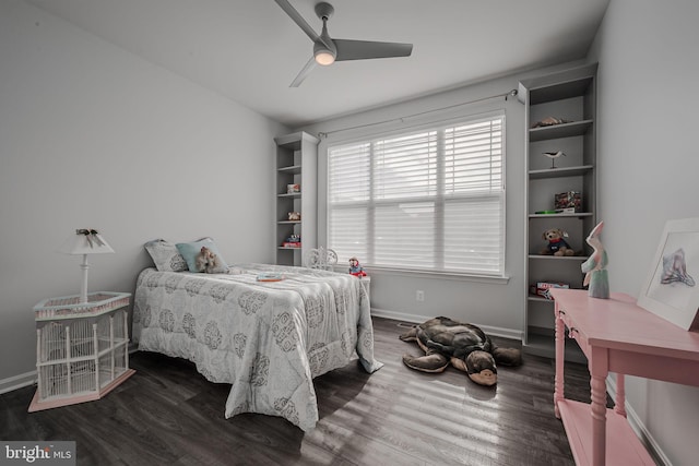 bedroom with ceiling fan and dark wood-type flooring