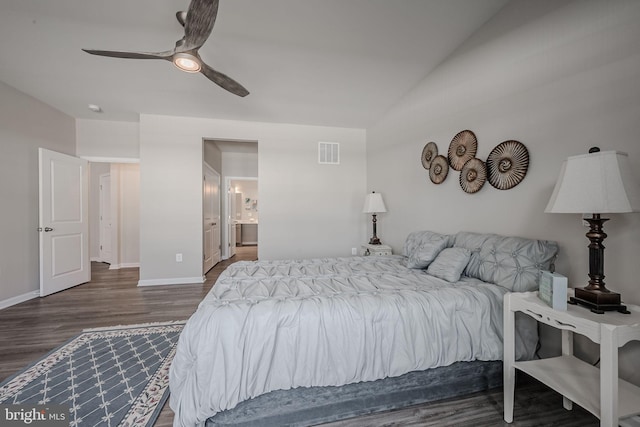 bedroom featuring ceiling fan, dark wood-type flooring, and connected bathroom