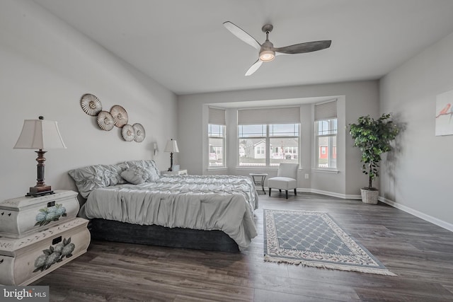 bedroom featuring ceiling fan and dark hardwood / wood-style flooring