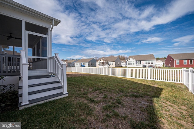 view of yard with a sunroom