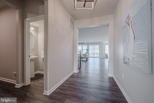 corridor featuring dark hardwood / wood-style flooring